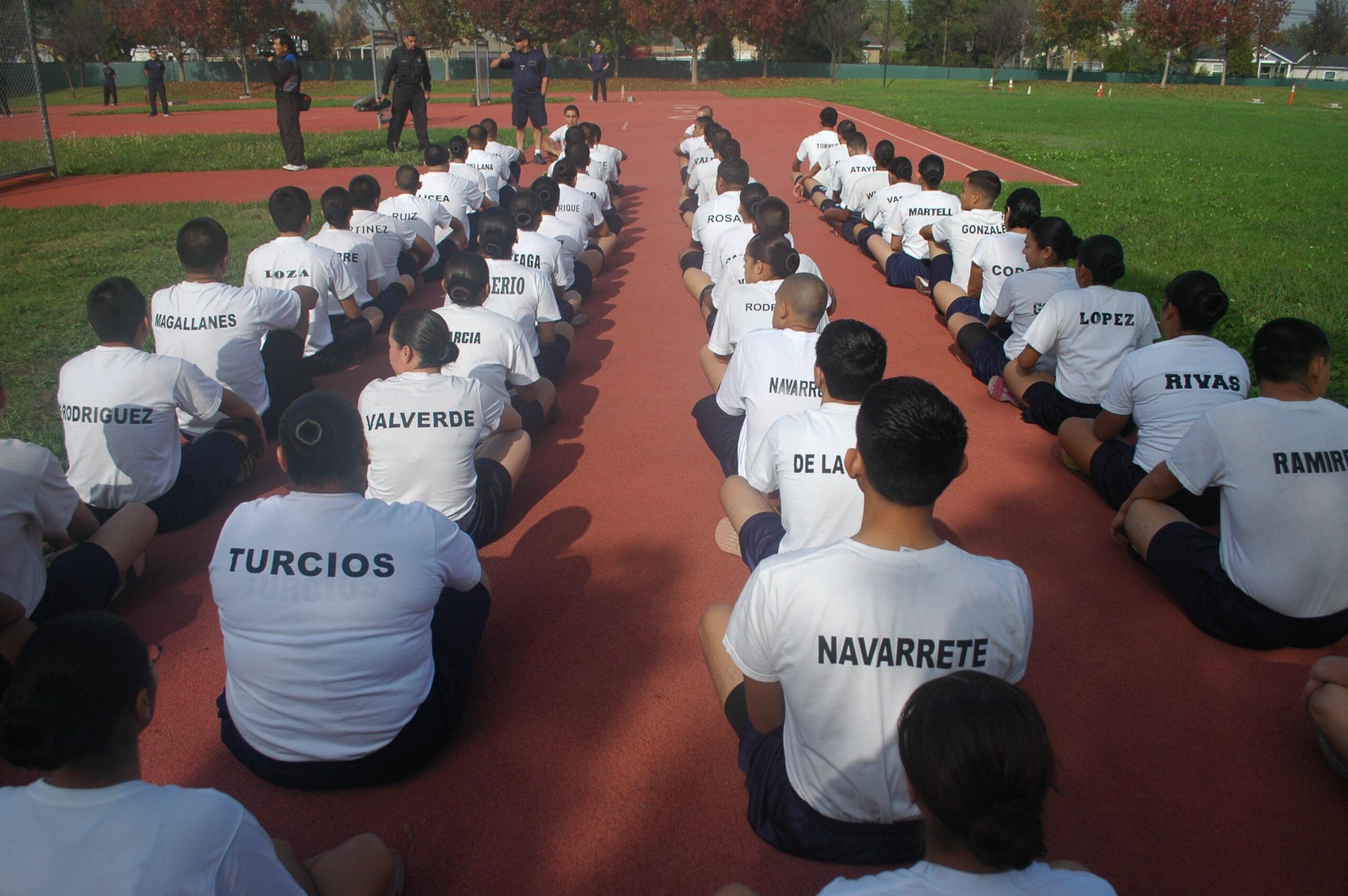 A Group of People Sitting on a Track