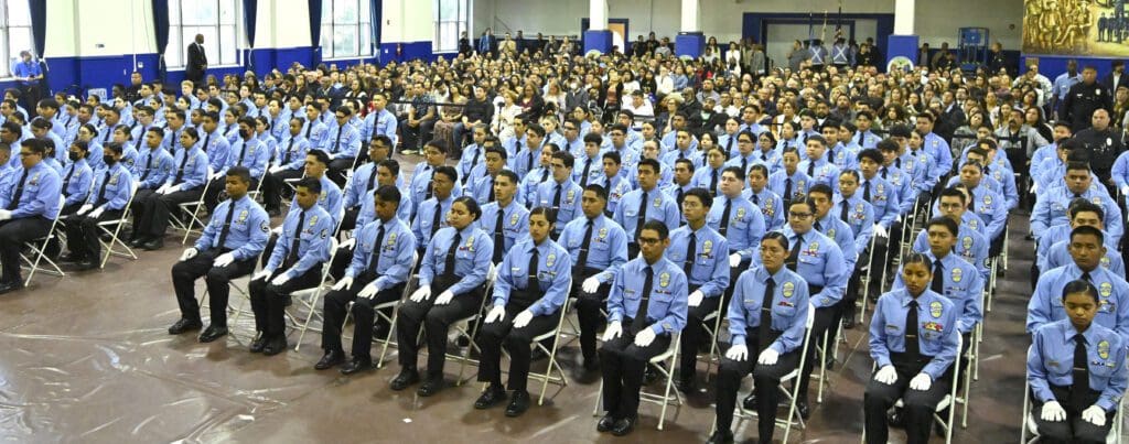 A Group of People in a Gym for a Ceremony