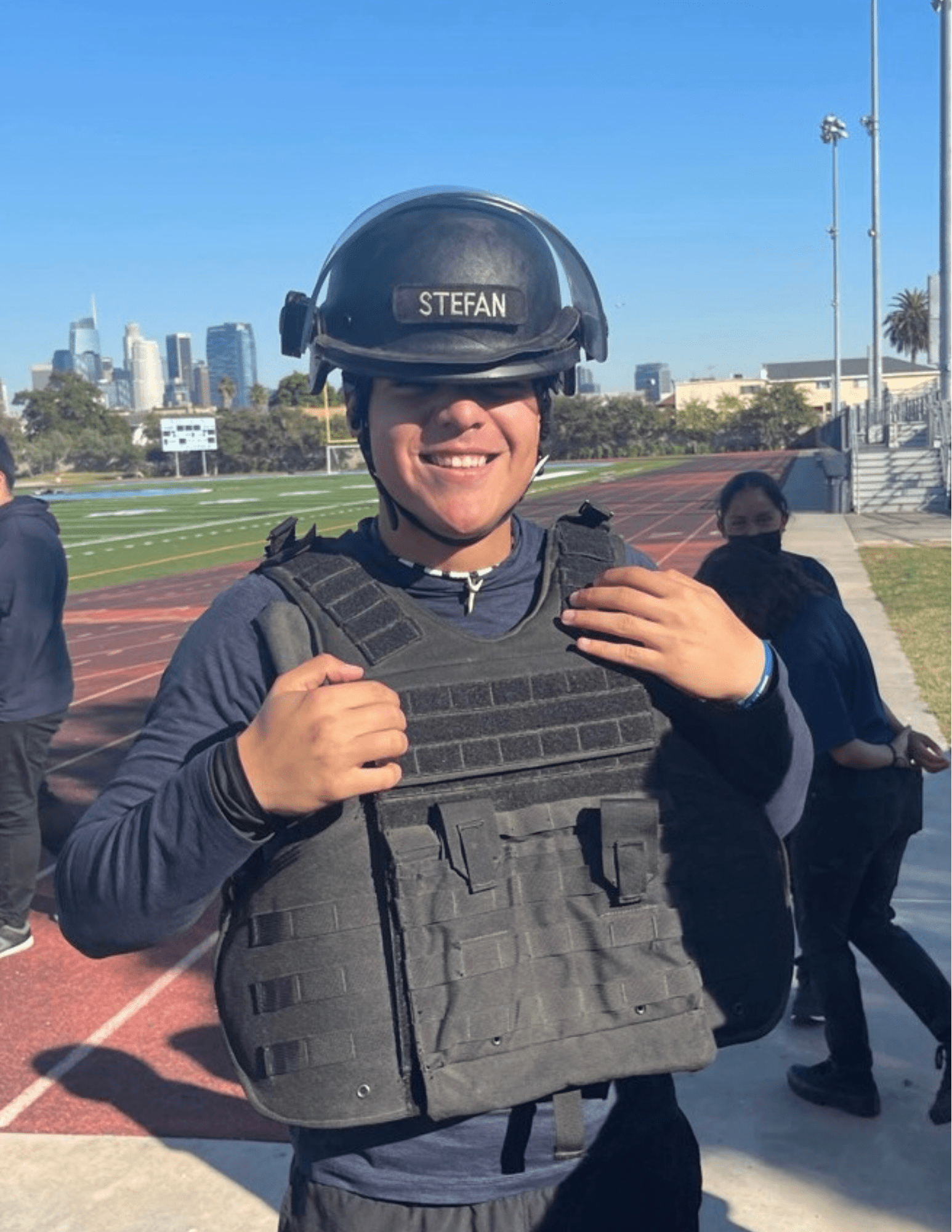 A Person Wearing a Helmet and Vest