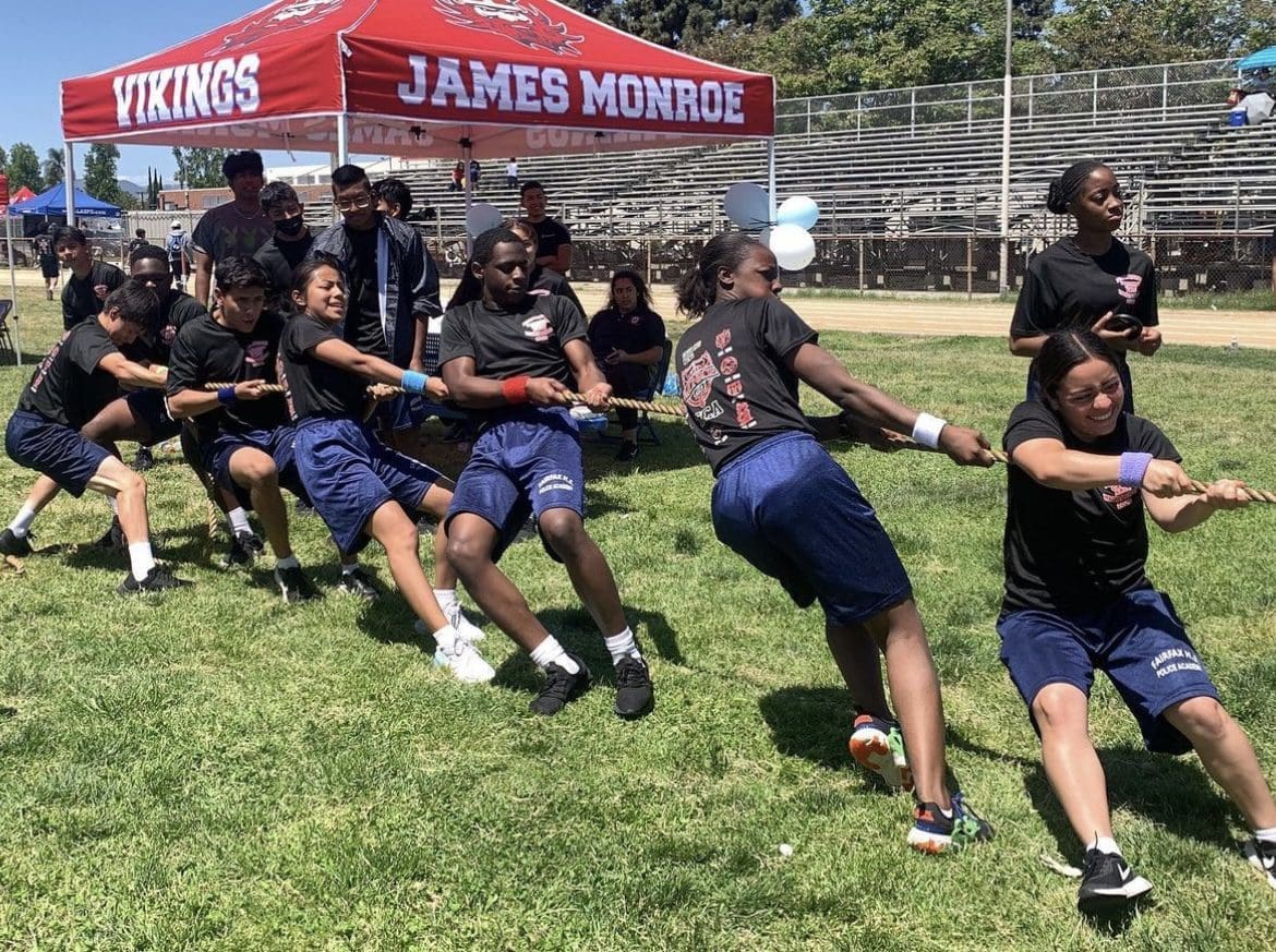 A Group of People Pulling a Rope