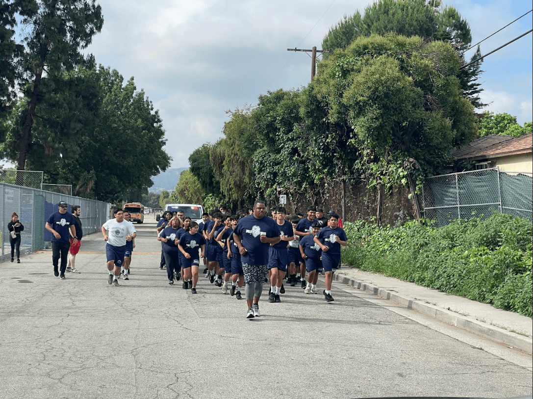 A Group of People Running on a Street